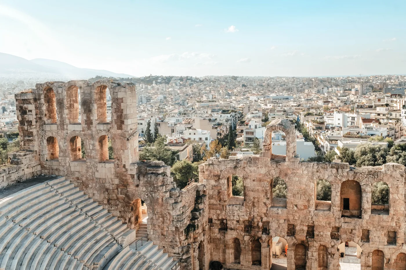 Athens with a view of the Odeon and the city in sunlight